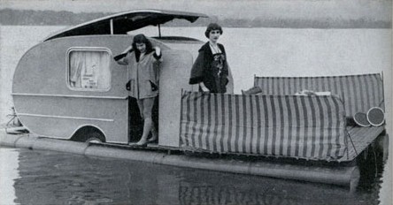 A monochrome photo of a caravan on floaters.